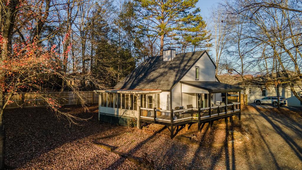 a view of a roof deck with wooden floor and fence