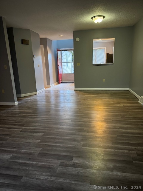 a view of a room with wooden floor