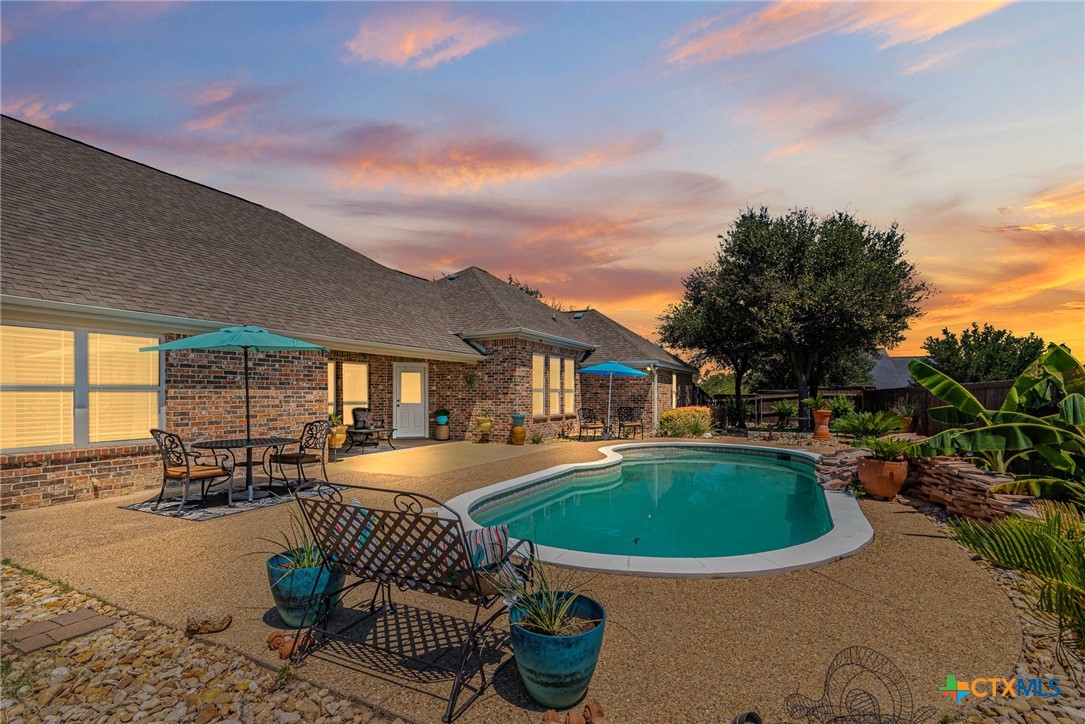 a front view of house with yard and outdoor seating