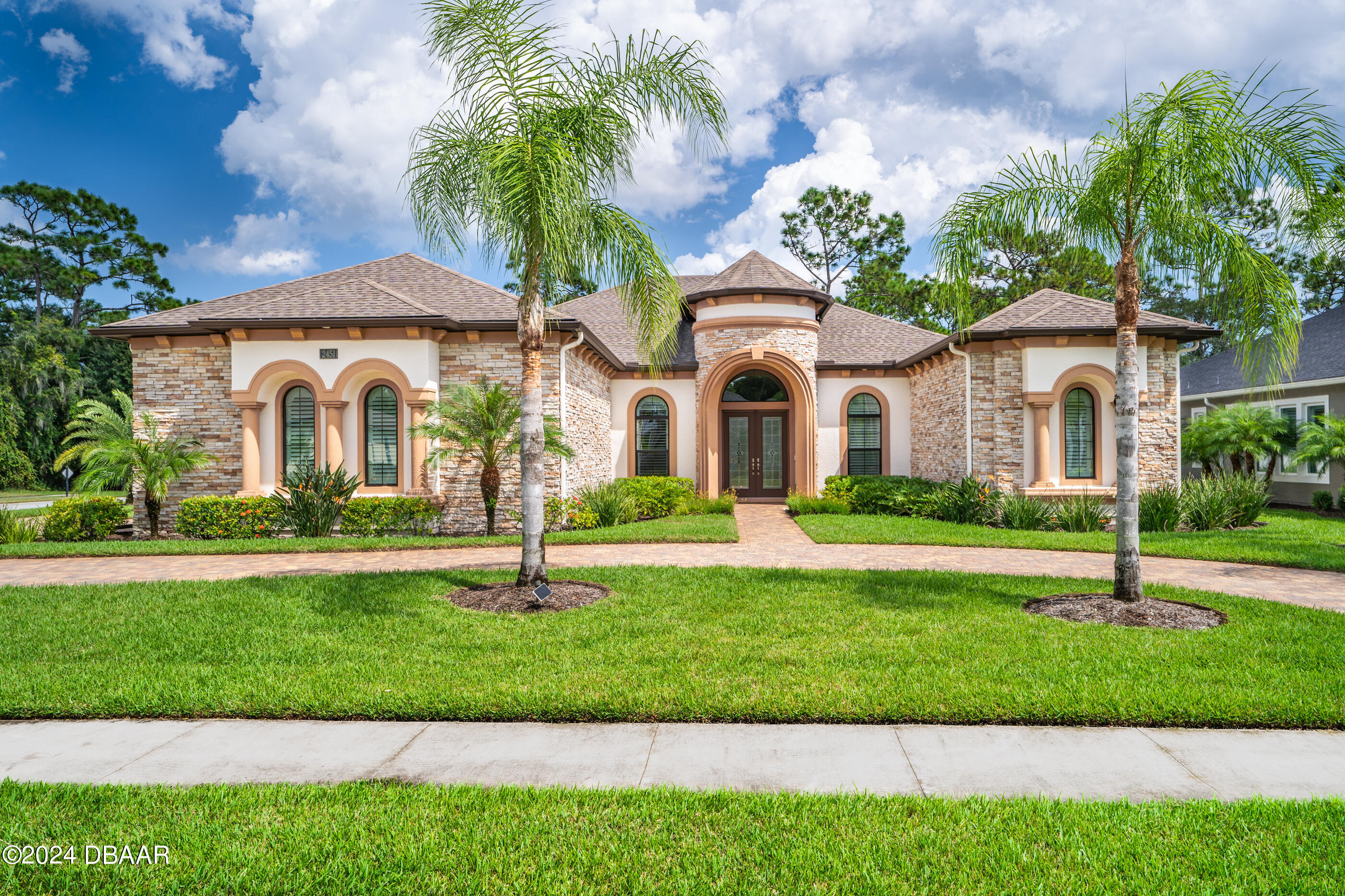 a front view of a house with a yard