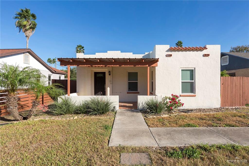 View of front of property featuring a front lawn