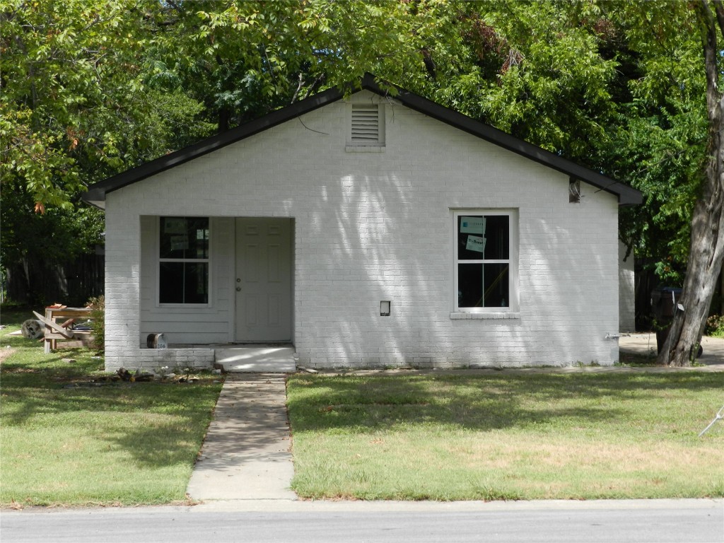 a front view of house with yard