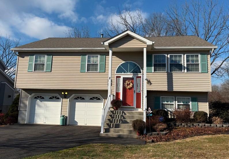 Raised ranch with  2 car garage