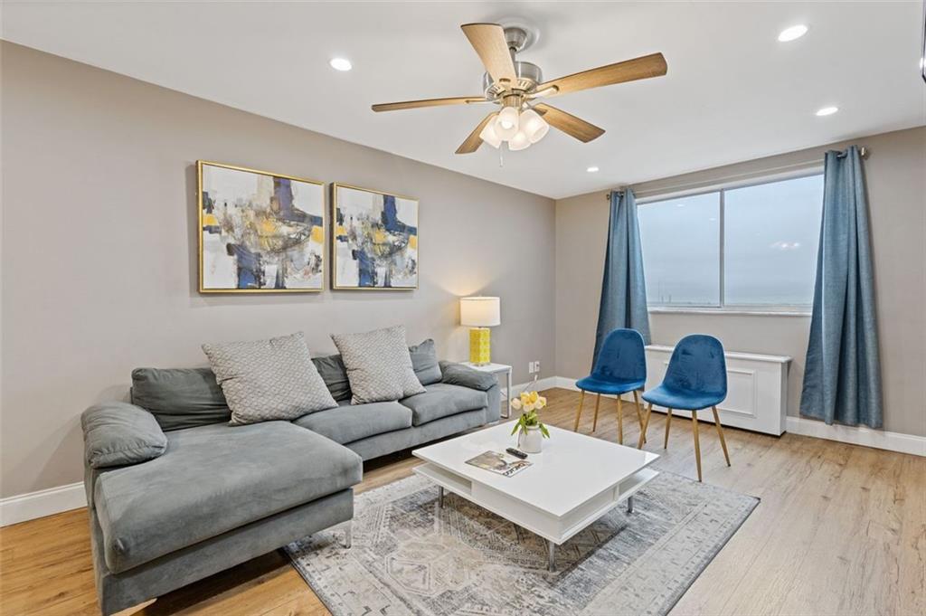 a living room with furniture and a window