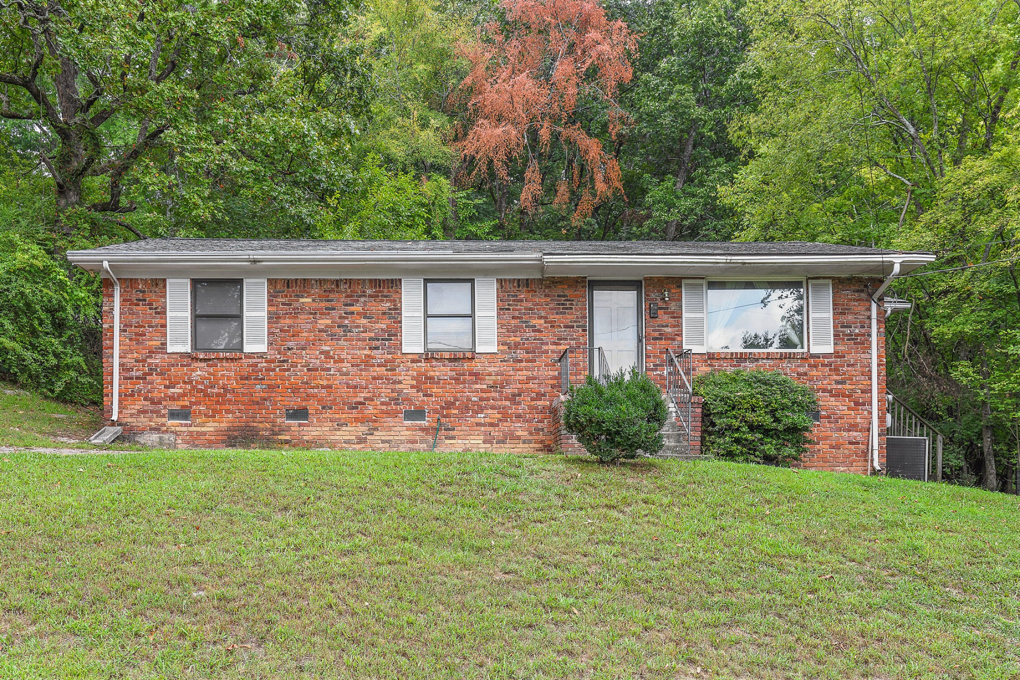 front view of a house with a yard