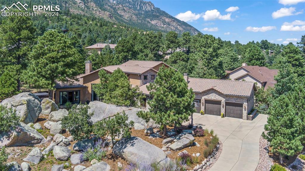 a aerial view of a house with a yard