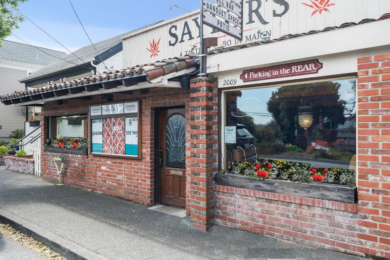 a front view of a building with flowers