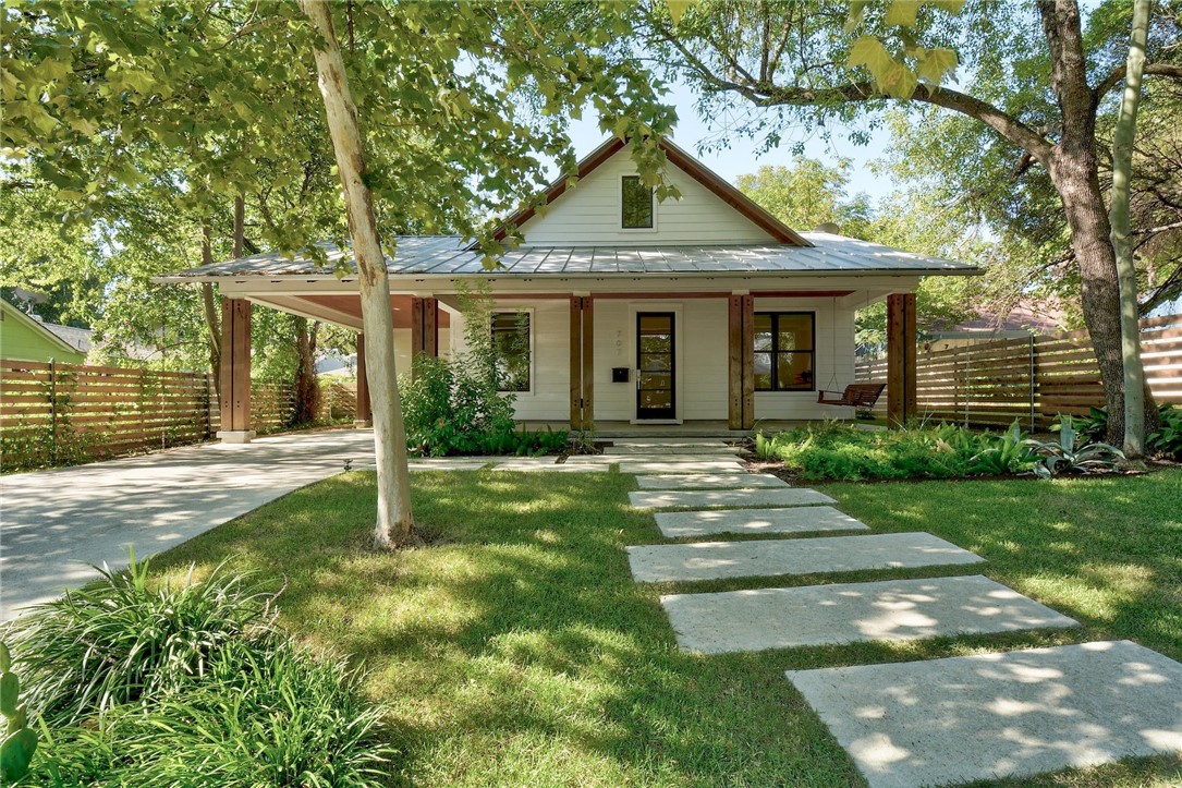 a front view of a house with yard