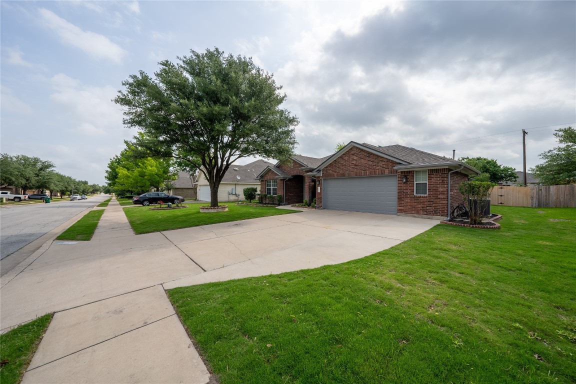 a view of house with backyard and entertaining space