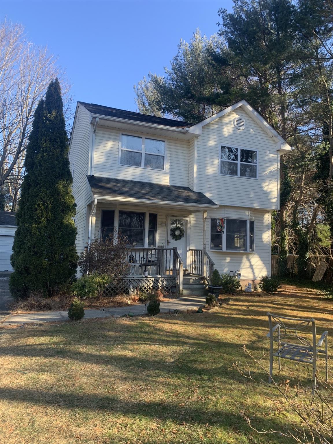 View of front of property with a front yard