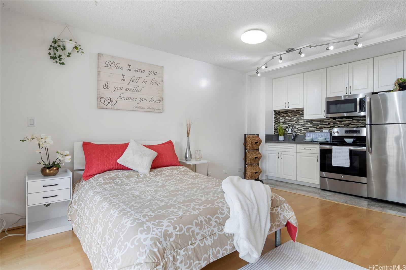 a bedroom with a bed and cabinets