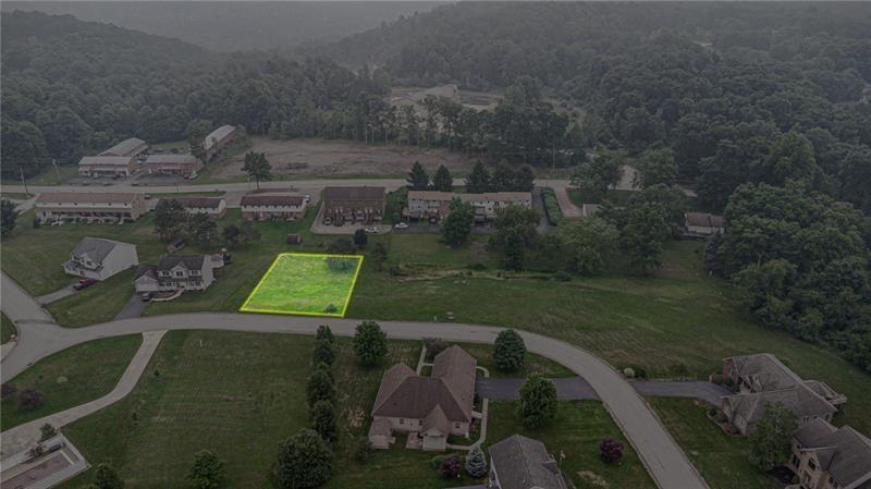 an aerial view of a house with yard swimming pool and outdoor seating