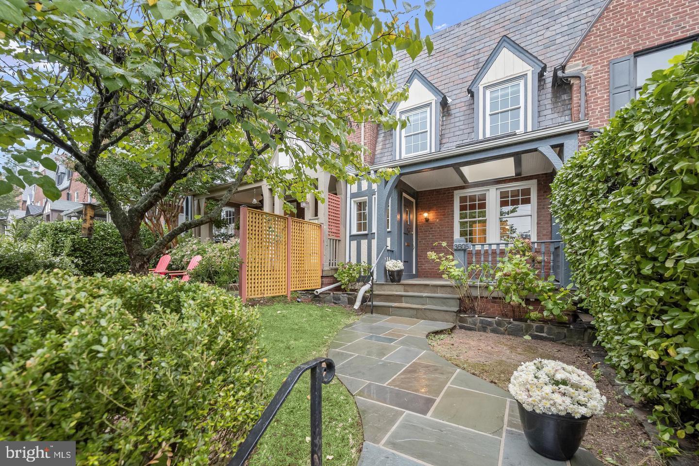 a front view of a house with garden