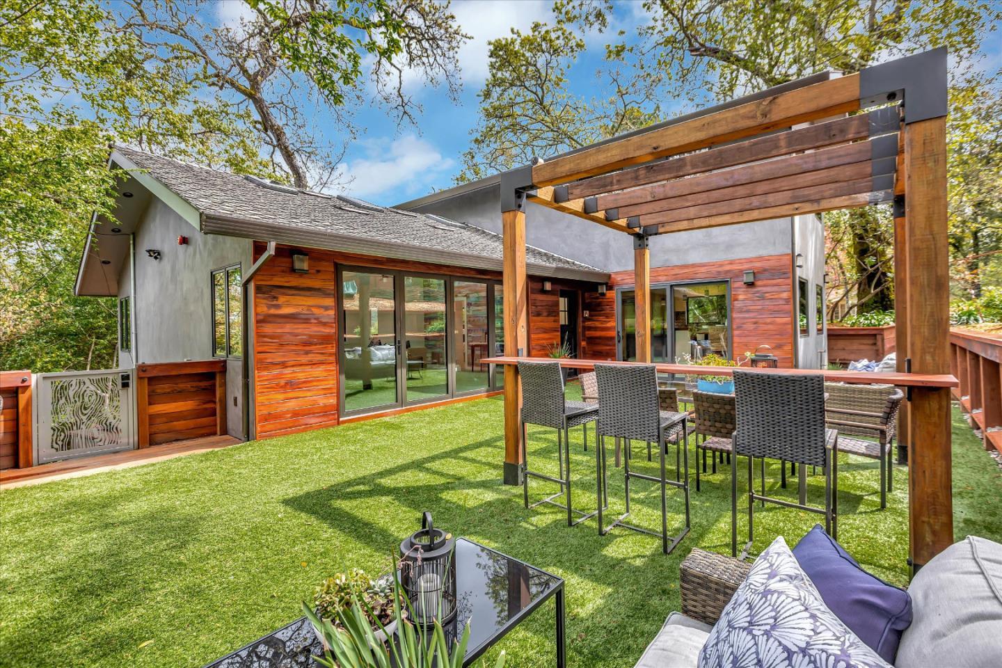 a view of an house with backyard porch and furniture