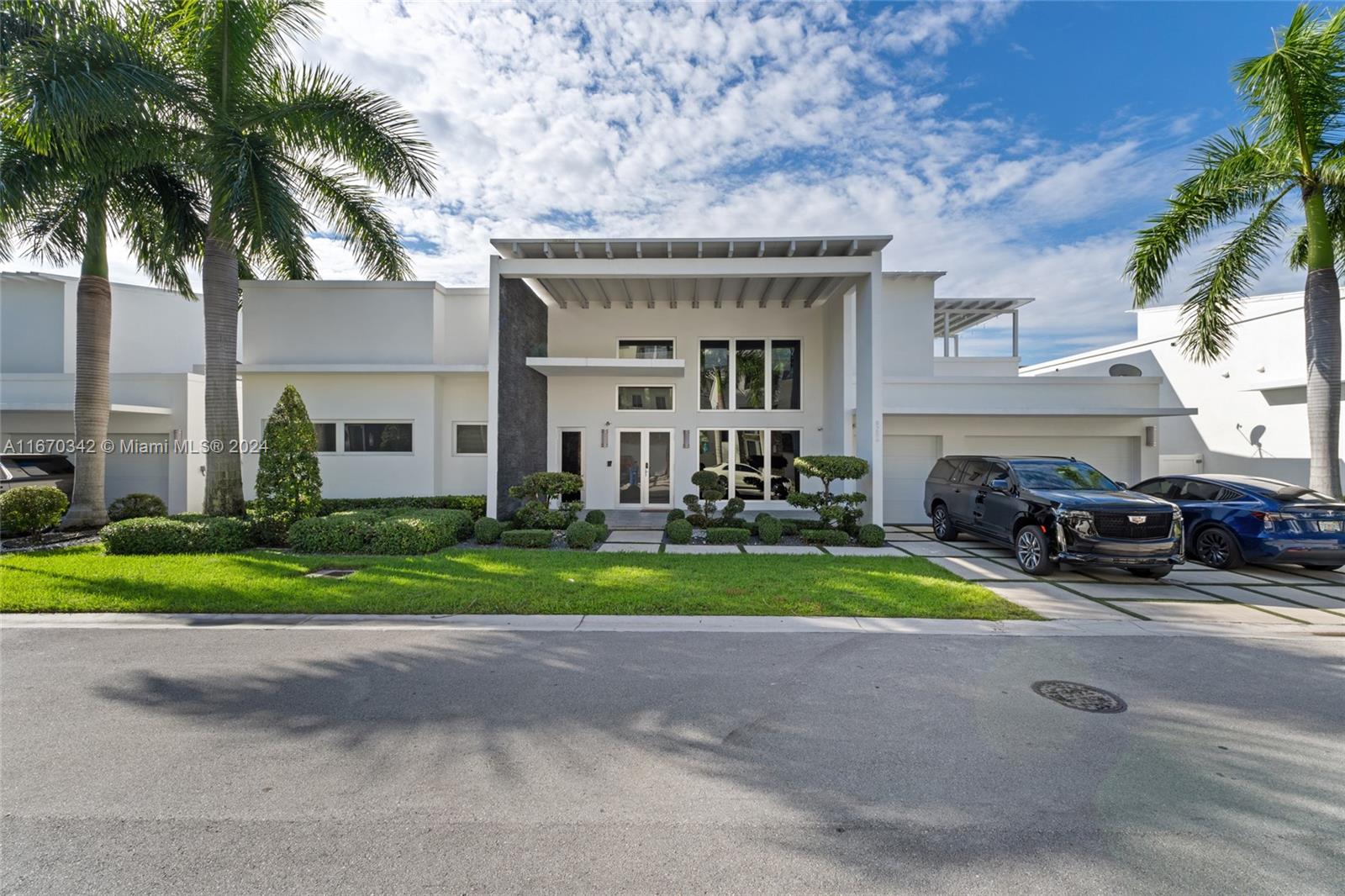 a view of house with outdoor space and parking