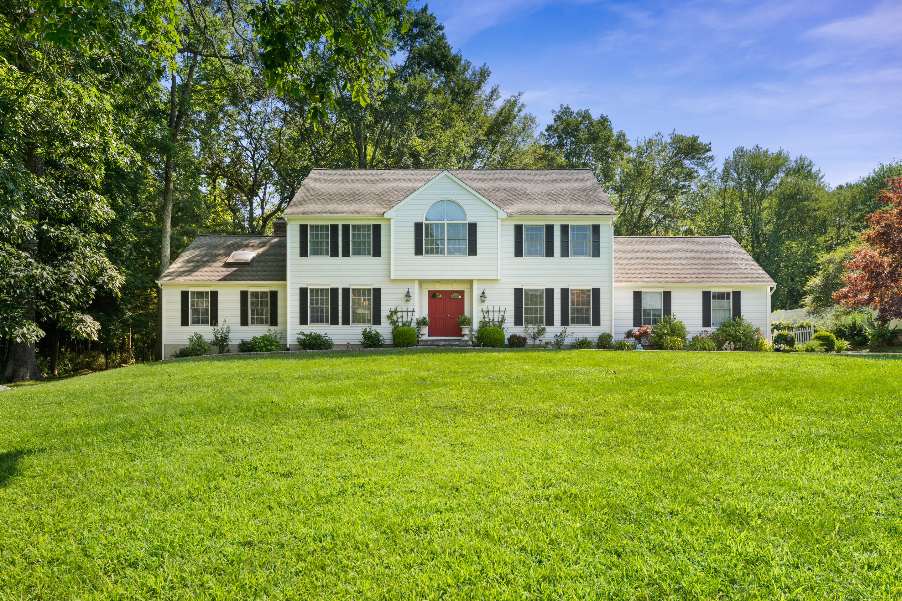 a front of a house with a garden