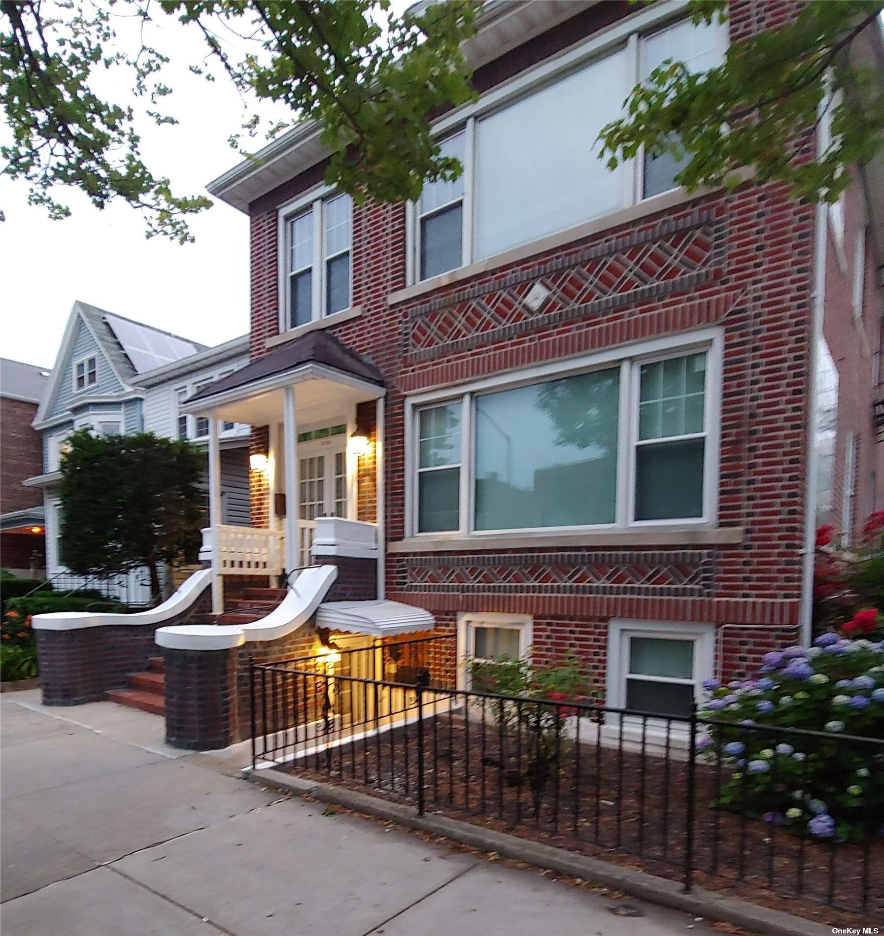 a view of a house with a chairs in patio