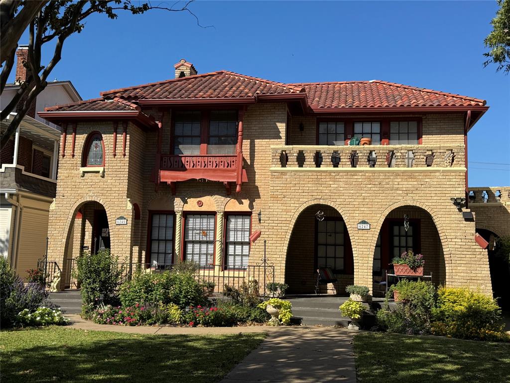 a front view of a house with yard