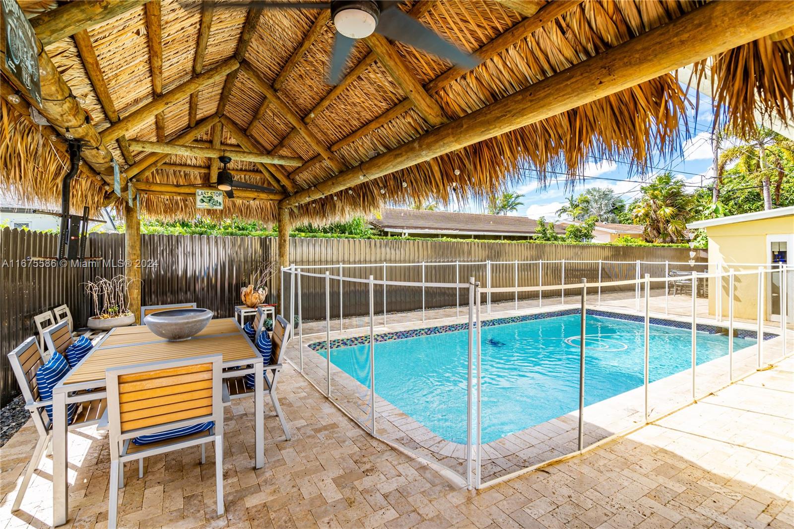 a view of a backyard with sitting area and furniture