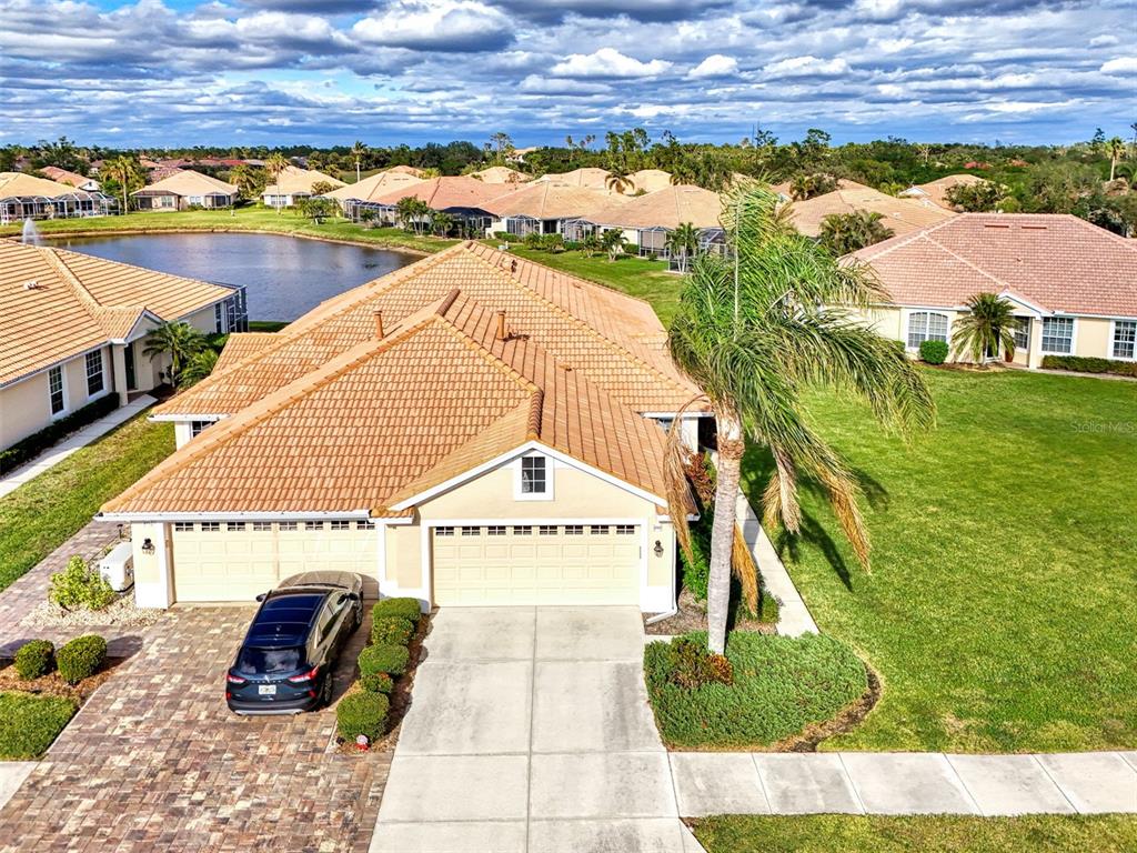 a view of multiple houses with a yard