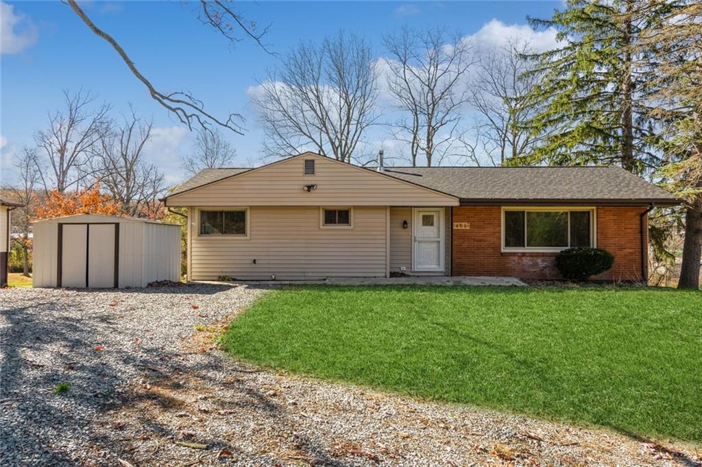 a front view of a house with yard