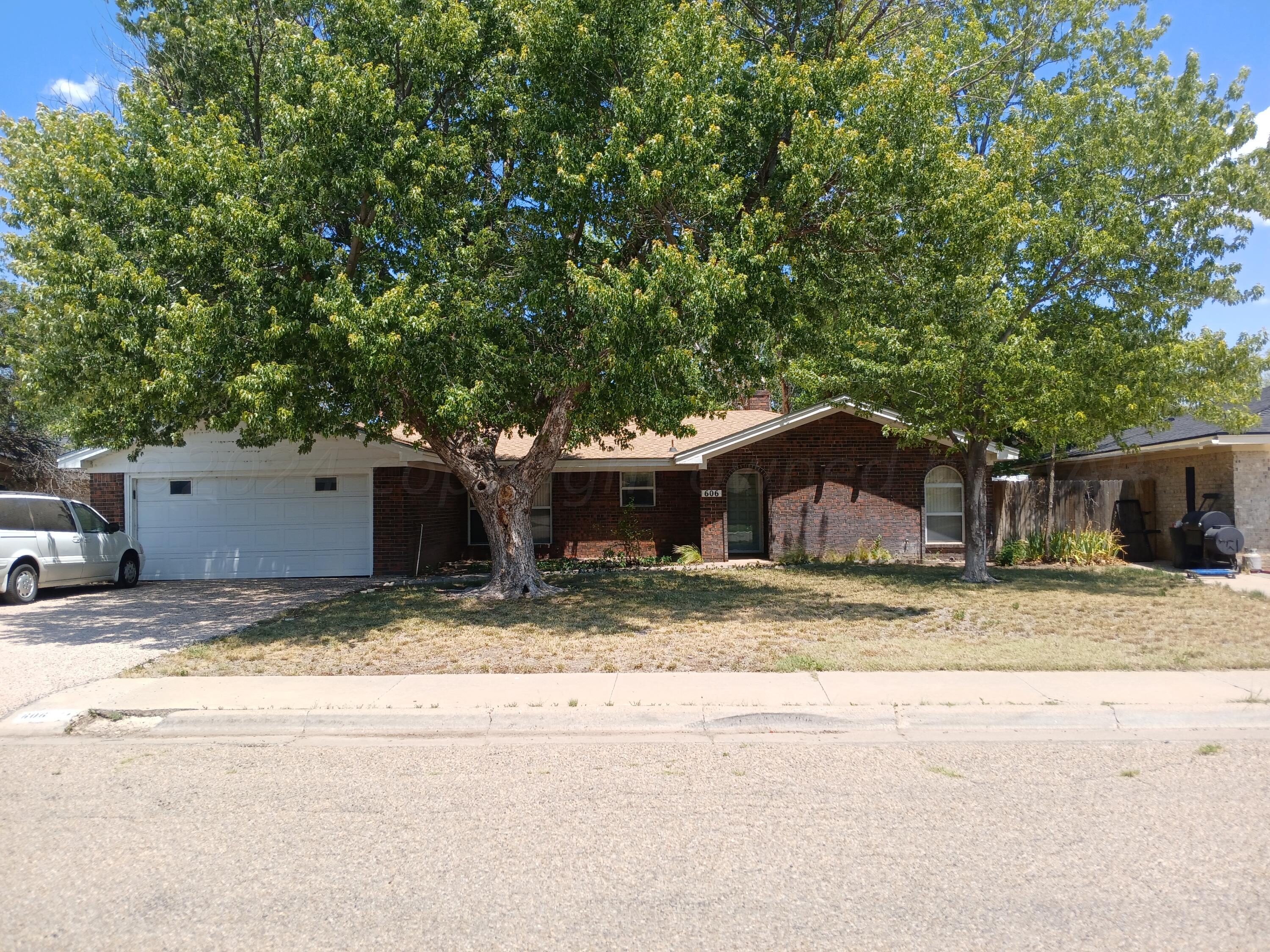 a house with a tree in front of it