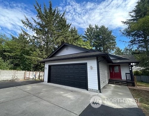 a front view of a house with a garage