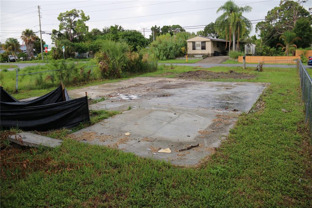 a backyard of a house with yard and trampoline