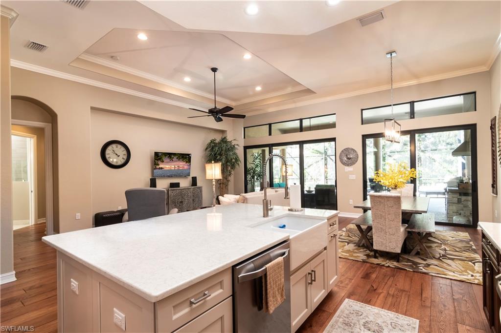 a large white kitchen with a large window