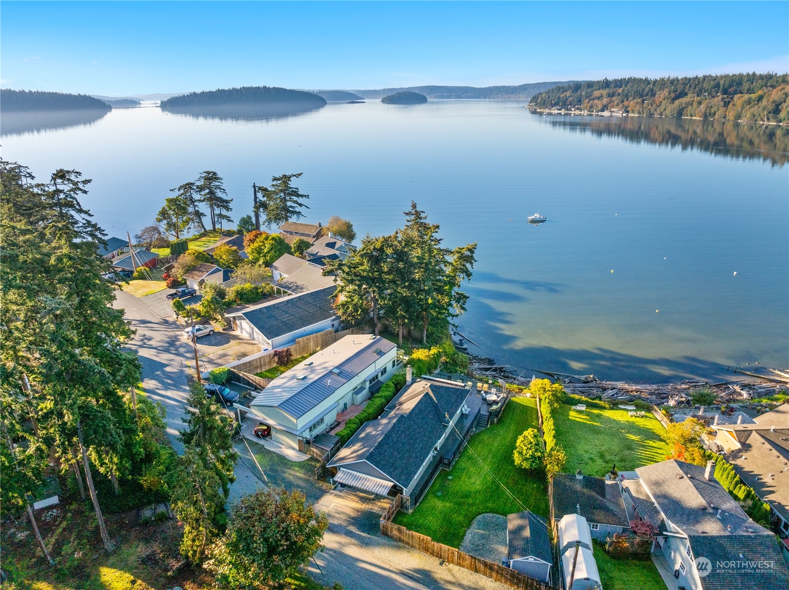 an aerial view of a house with a lake view