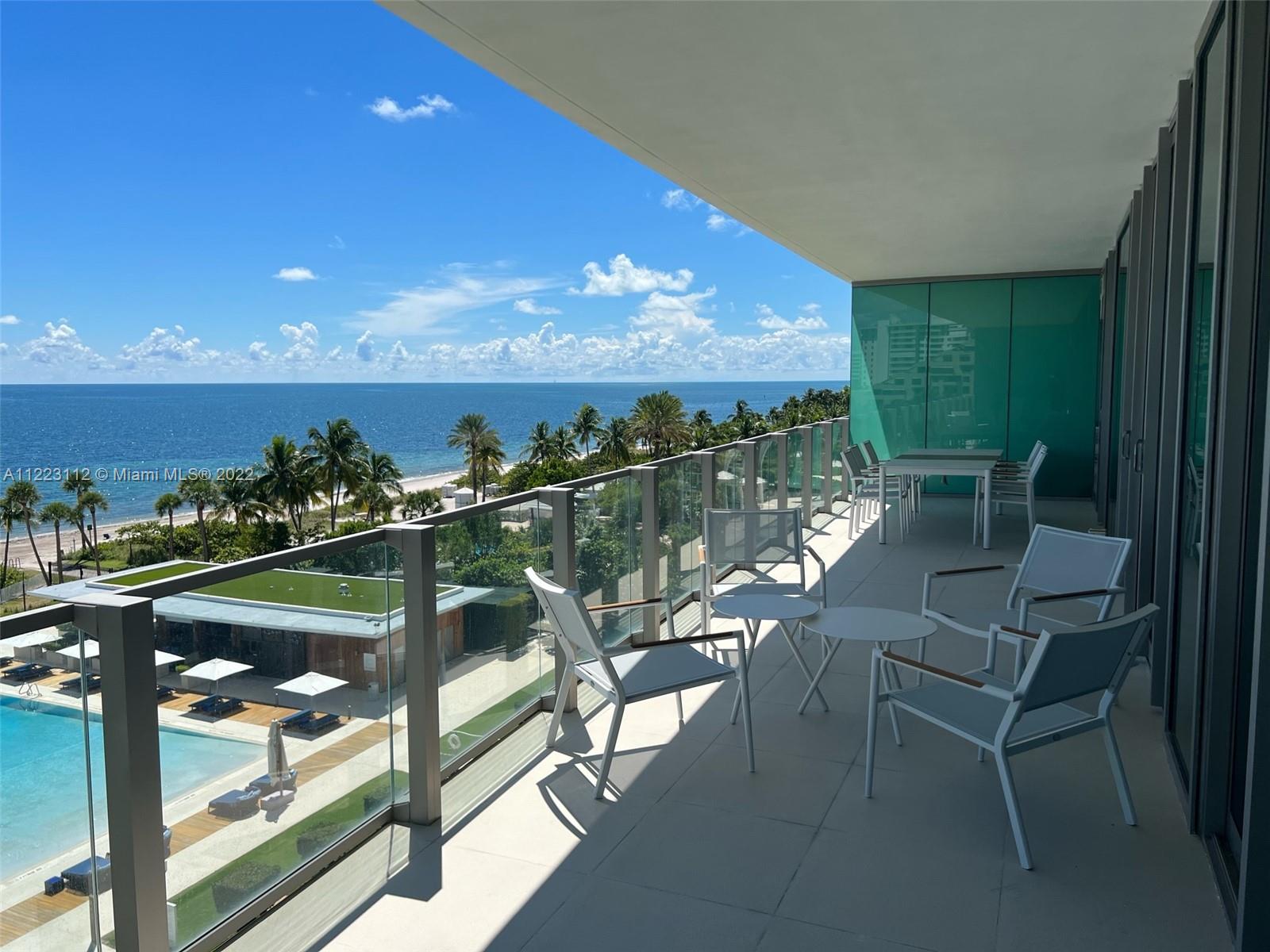 a view of a chairs and table in patio