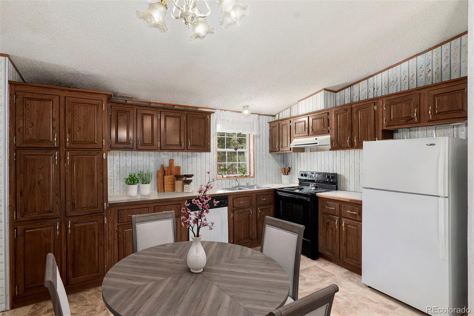 a kitchen with a refrigerator a stove a sink dishwasher and white cabinets with wooden floor