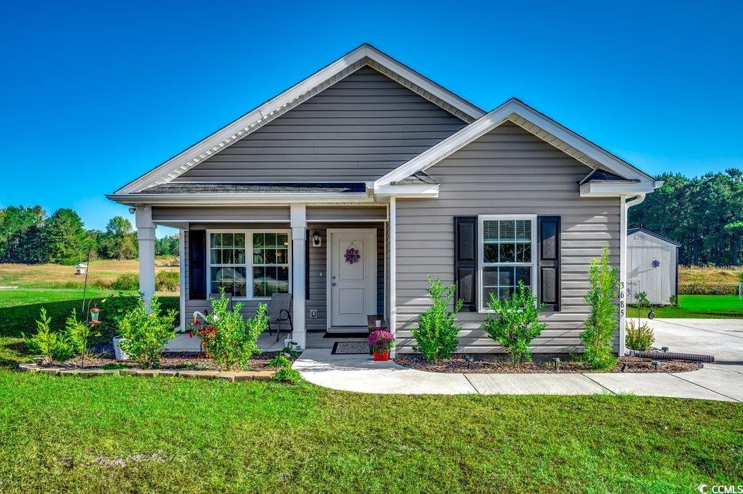 View of front of property featuring covered porch