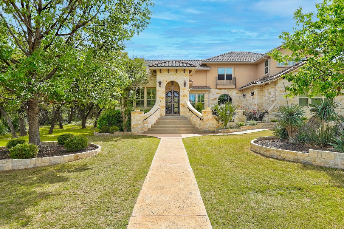 a front view of a house with garden