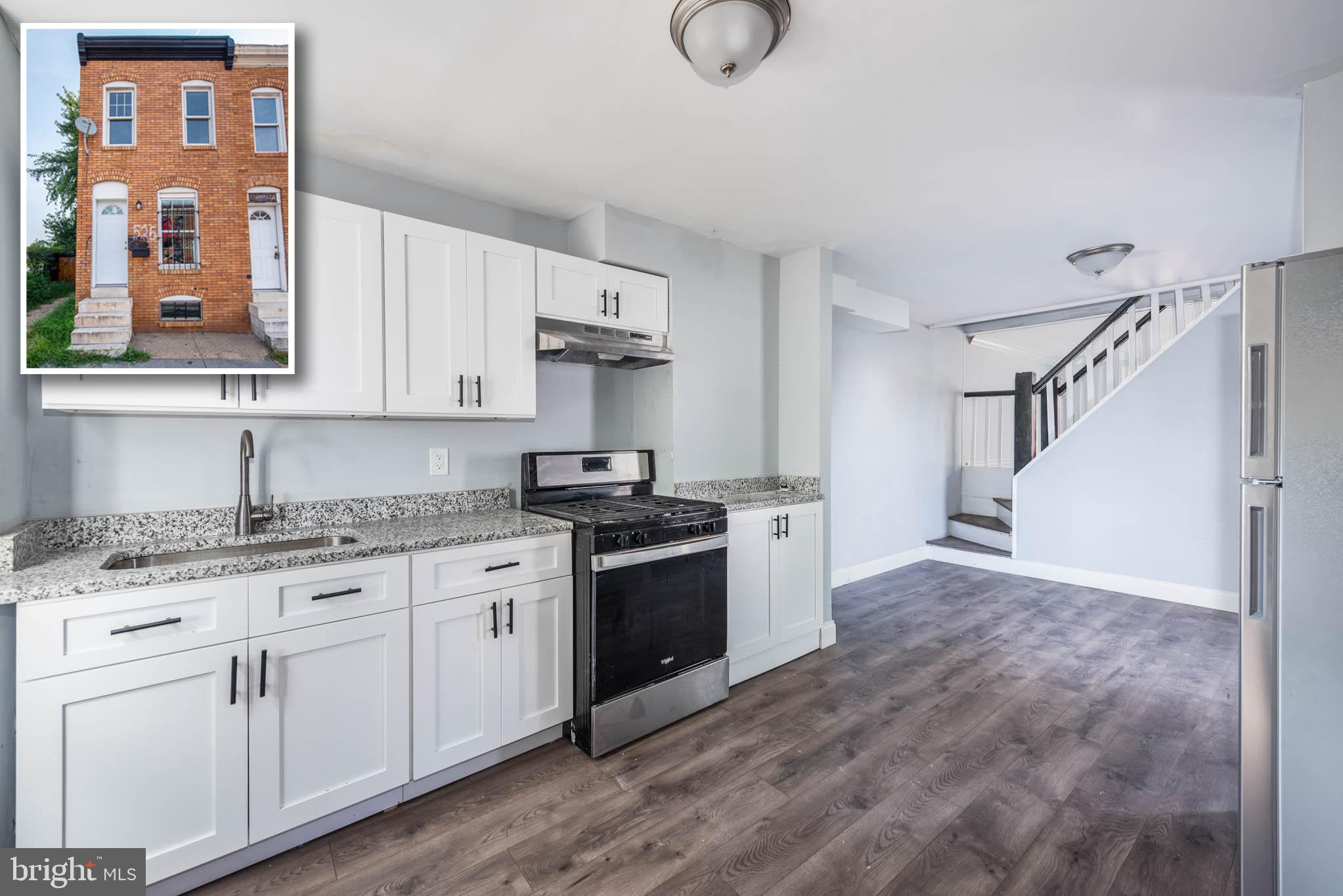 a kitchen with granite countertop a stove a sink and dishwasher with granite countertops