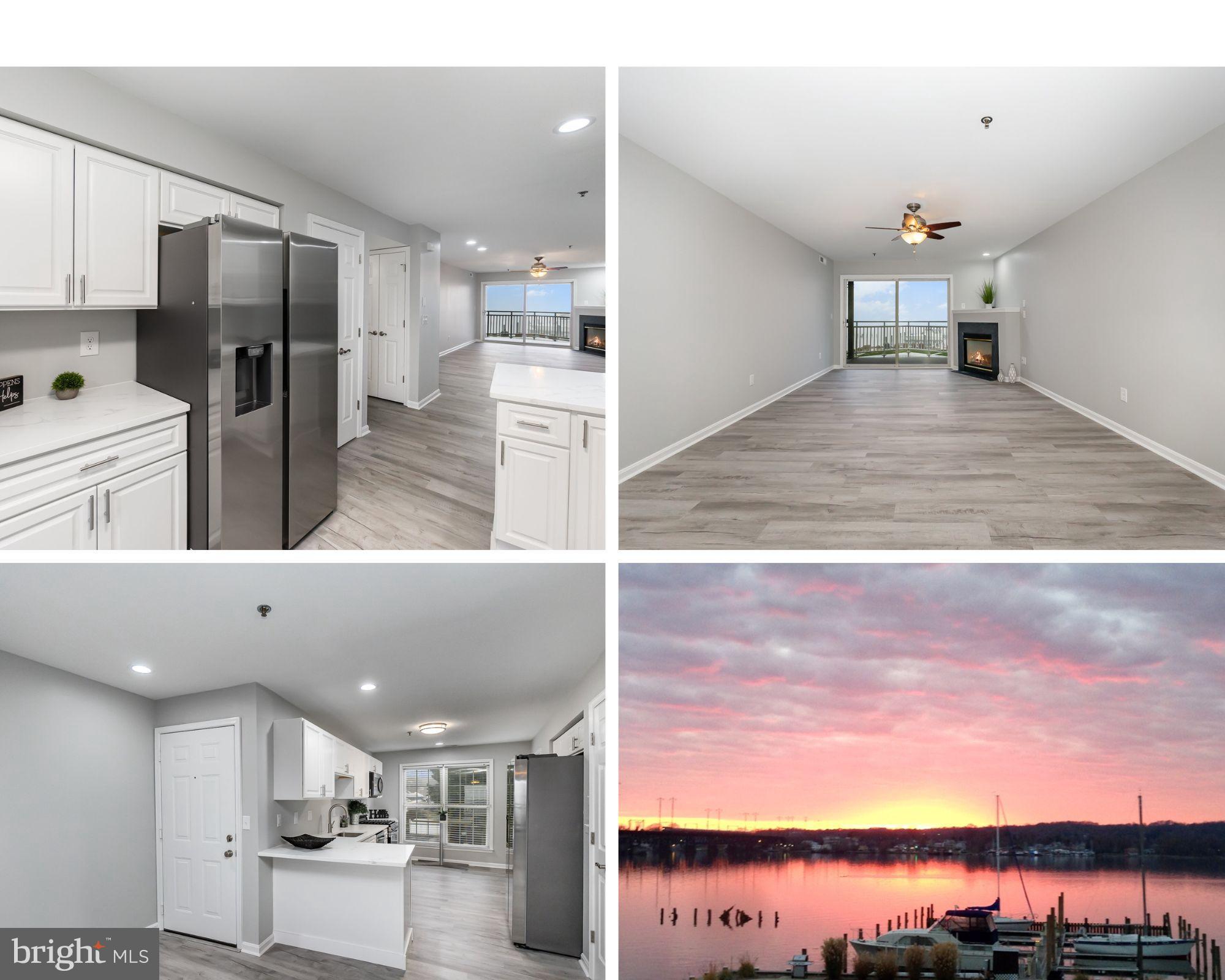 a view of a kitchen with kitchen island white cabinets and stainless steel appliances