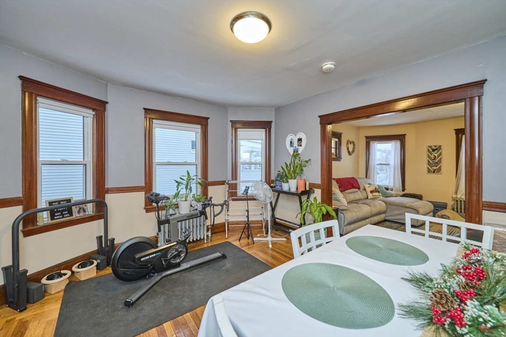 a room with gym equipment and a large window