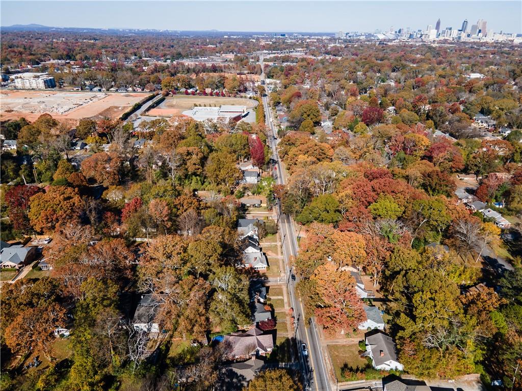 an aerial view of residential houses with city view