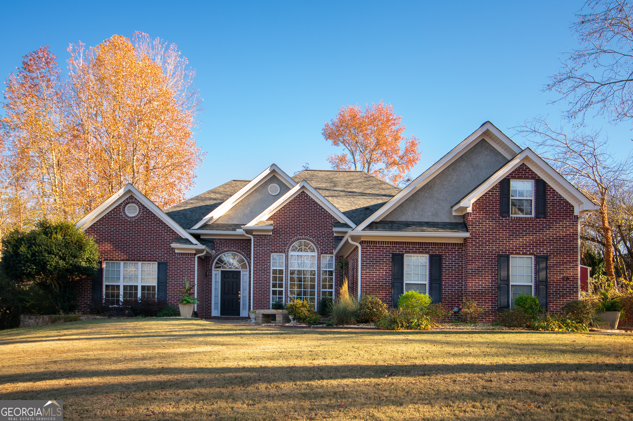 a front view of a house with a yard