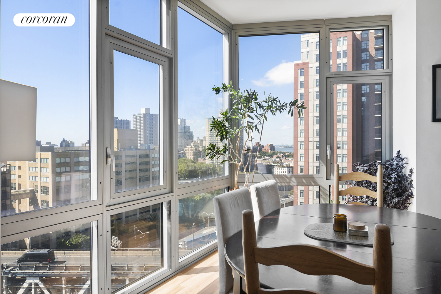 a view of a dining room with furniture and a window