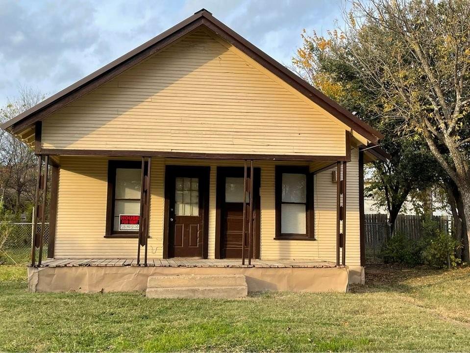 front view of a house with a yard