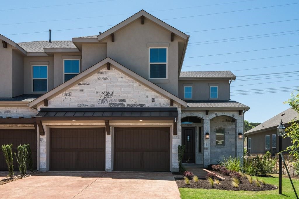 a view of a house with a garage