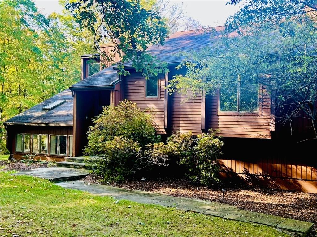 View of home's exterior featuring a yard