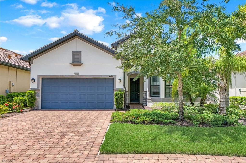 View of front of property with a garage