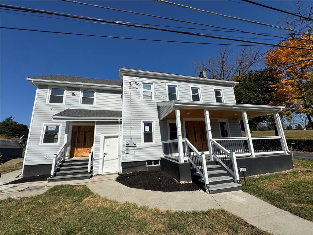 a front view of a house with porch