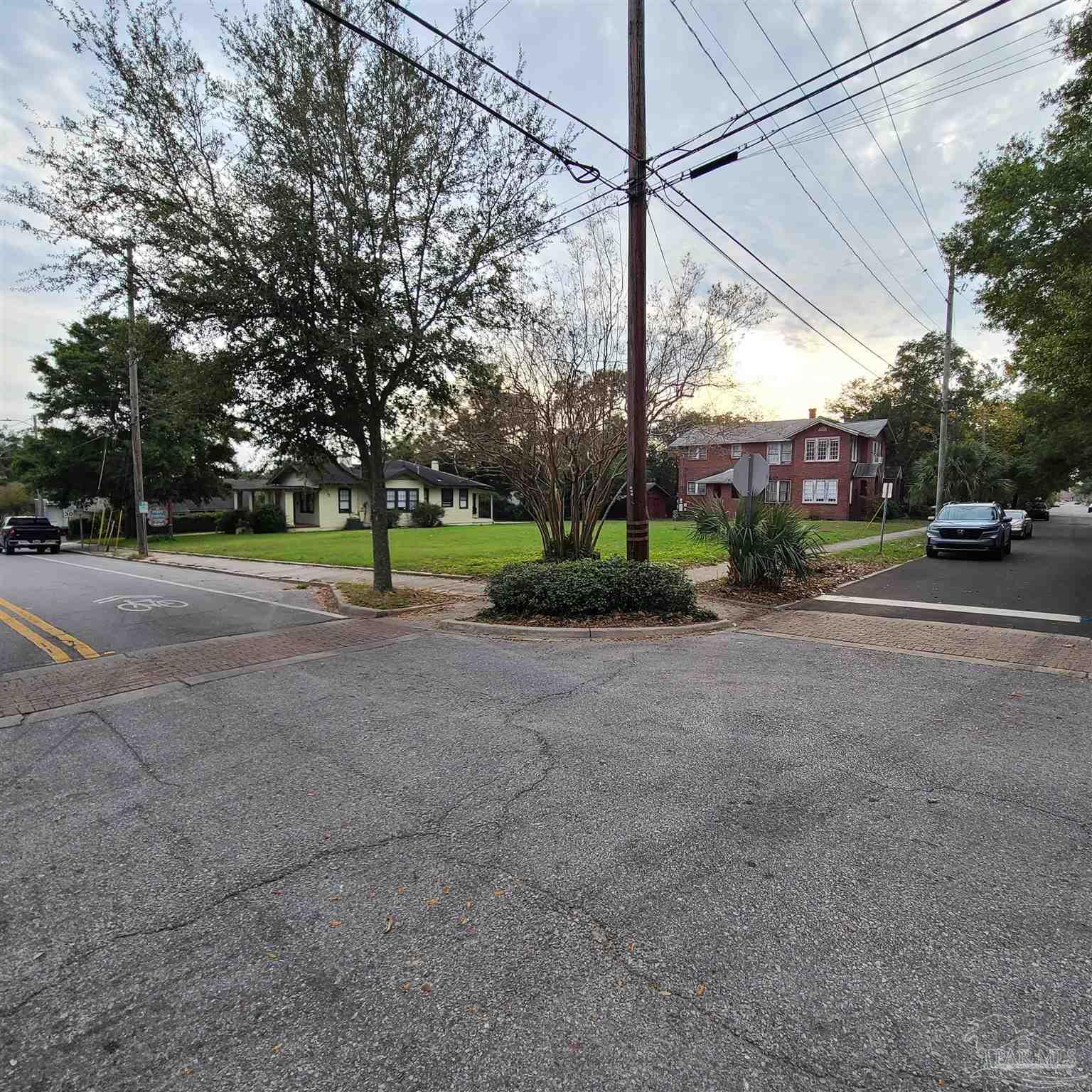 a view of a road with a building in the background