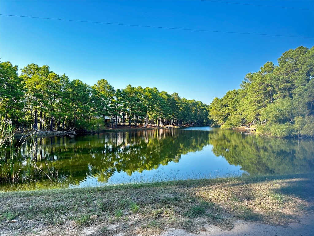 a view of a lake with a yard