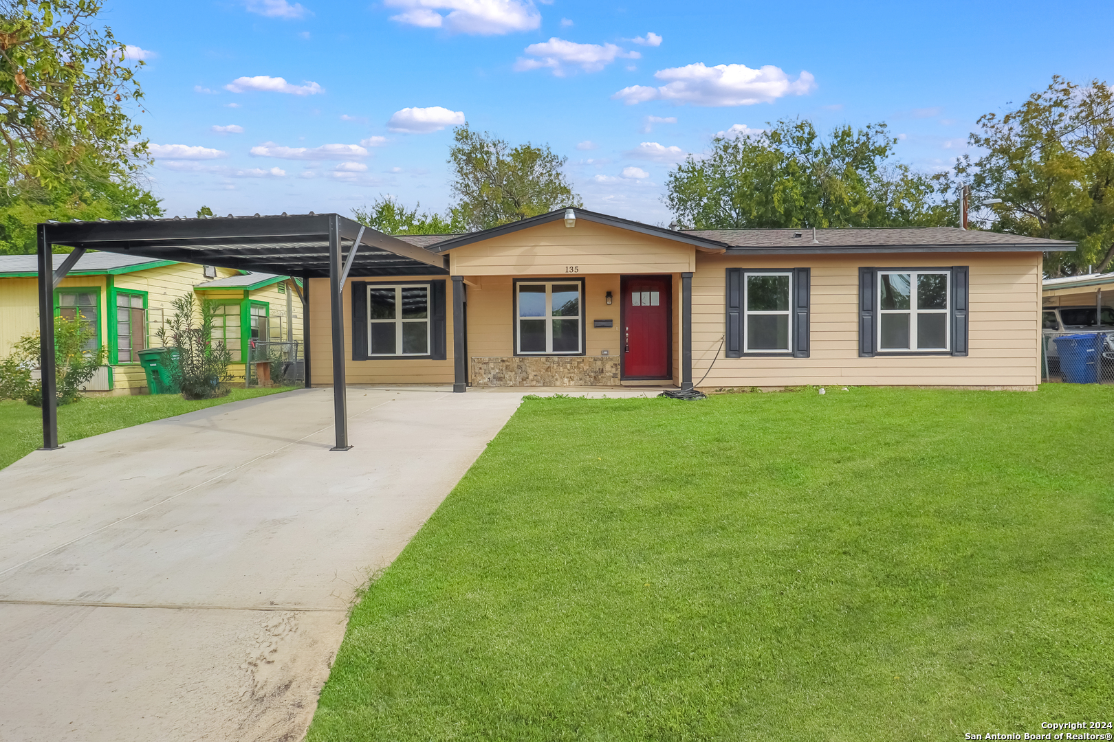 a front view of a house with a yard and porch