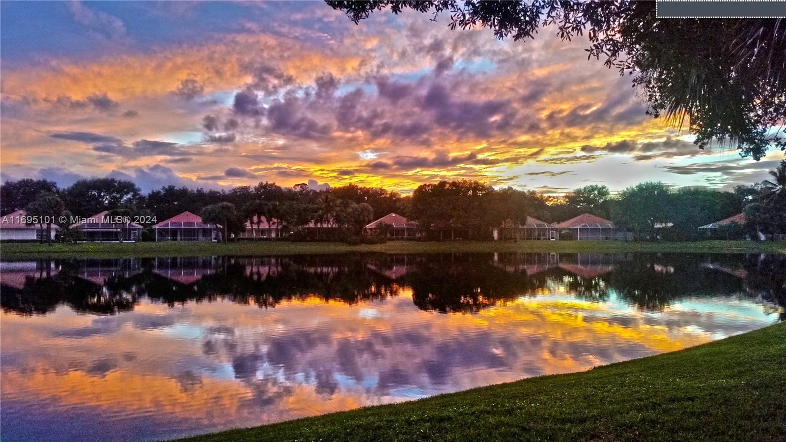 a view of a lake in middle of a house with a lake view