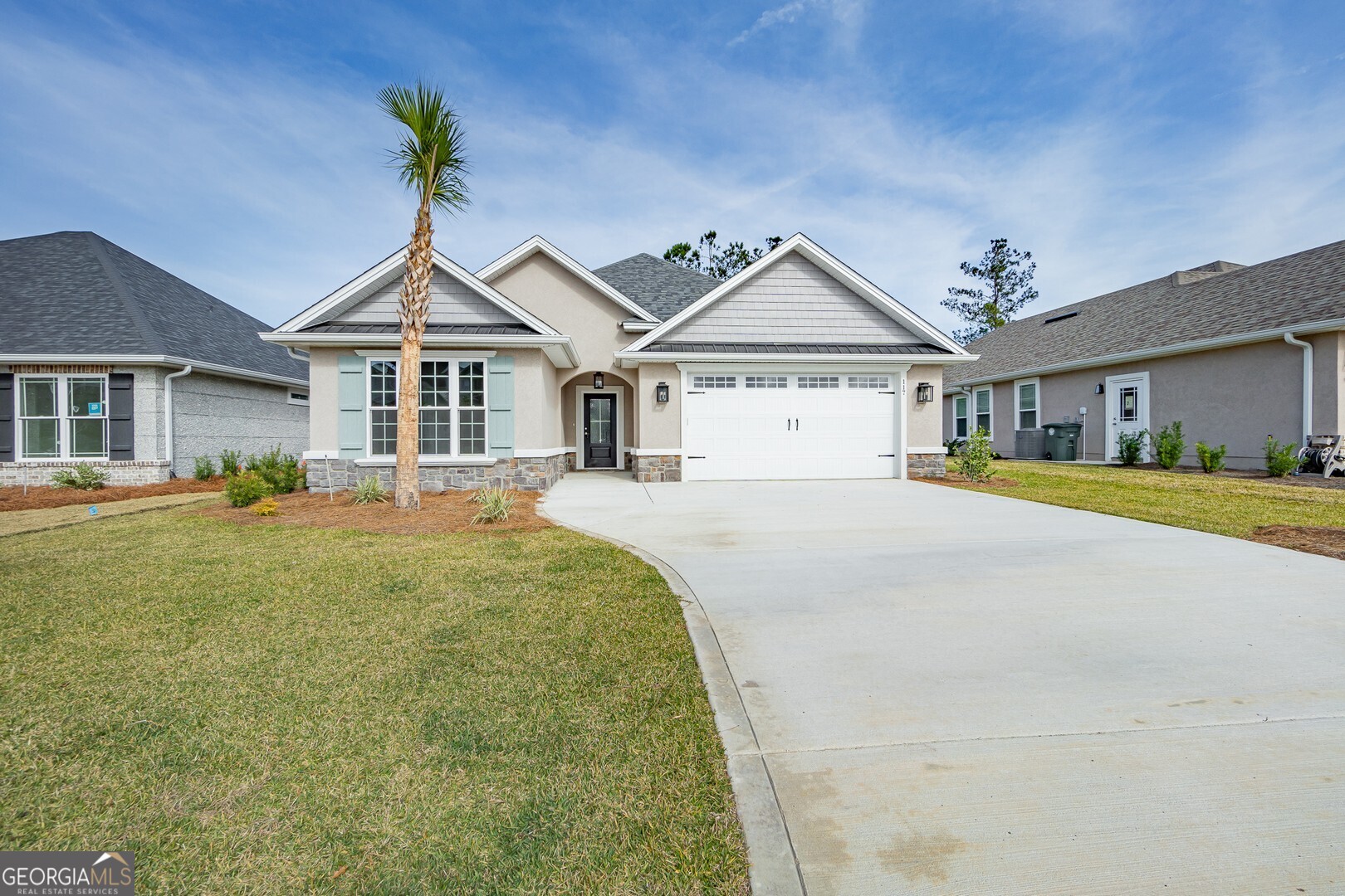 a front view of a house with a yard